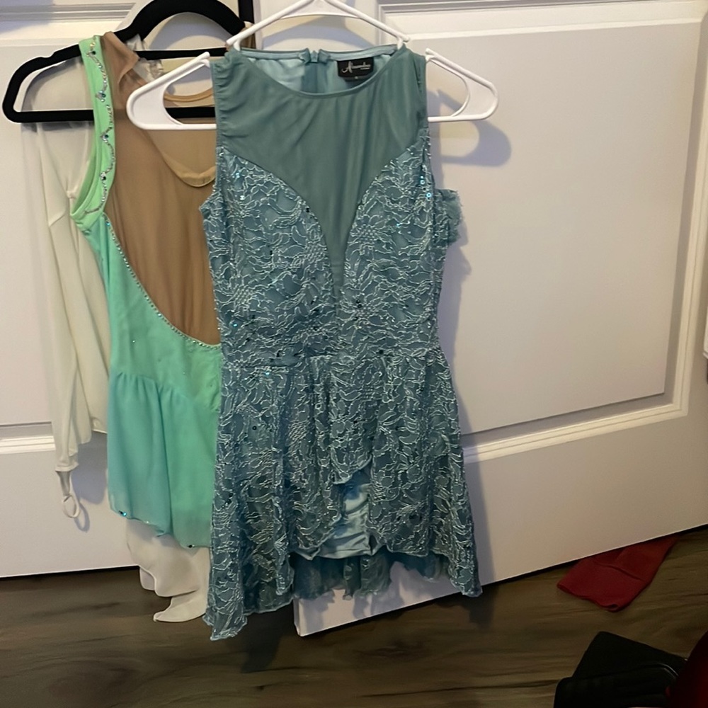 Worn once, Blue with lace, comes with a clip for hair Figure/ Dance costume